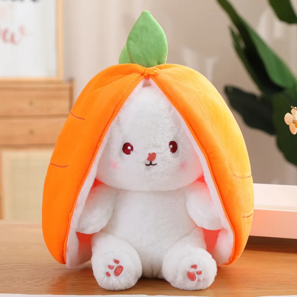 A plush toy combining elements of a white rabbit and an orange carrot, with the rabbit peeking out of the split carrot top adorned with a green leaf.